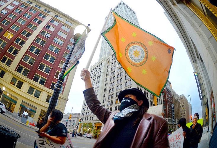 Joseph Price marching with a tribal flag at the October 2021 Tulsa City Hall rally opposing the effort to overturn McGirt v. Oklahoma
